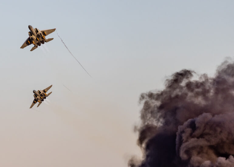 Israeli Air Froce F-15 Ra'am buzzing up above smoke after air to ground attack