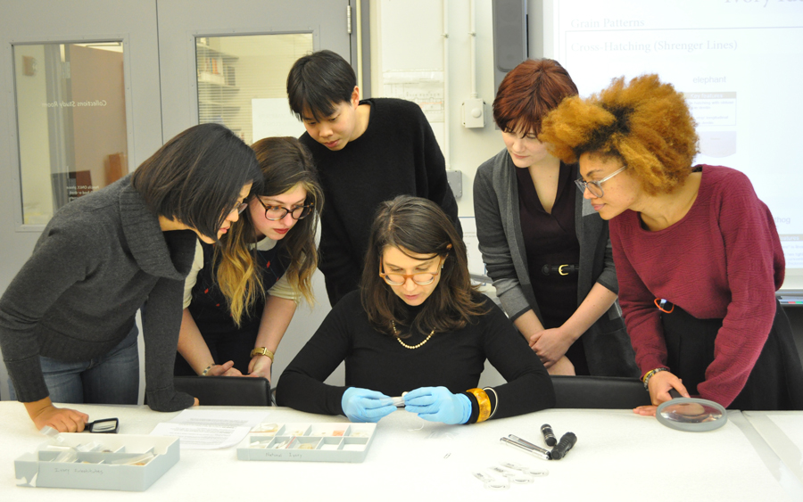 Students in the archives learning about an artifact.