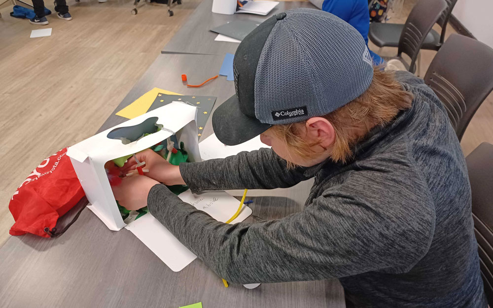 A camper making a diorama.