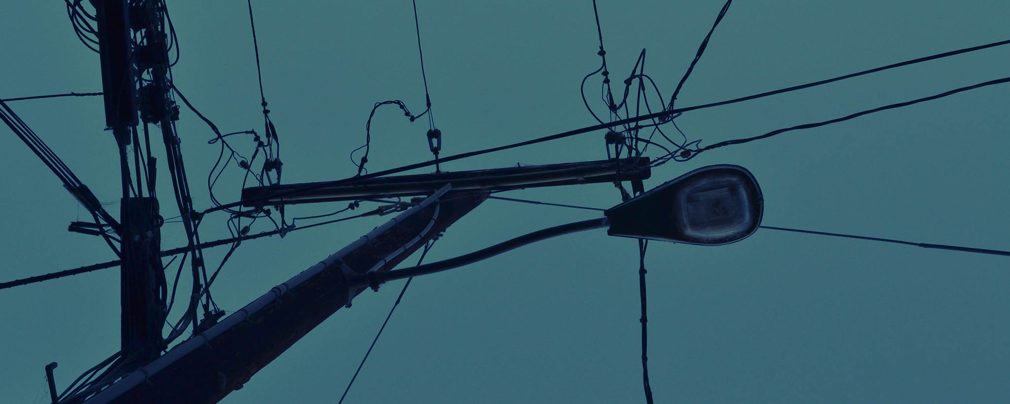 Unlit street light at night