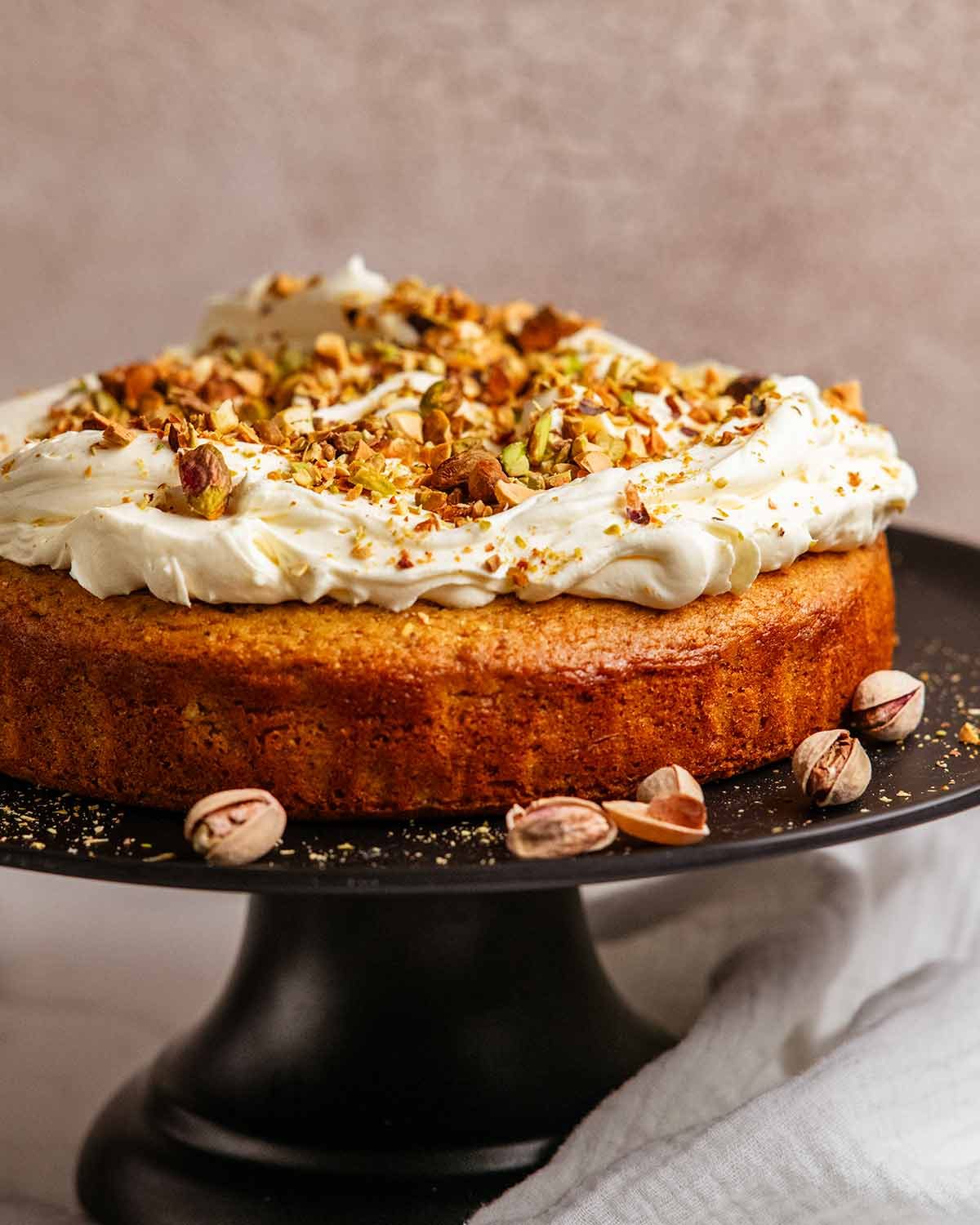 Pistachio cake on a cake stand