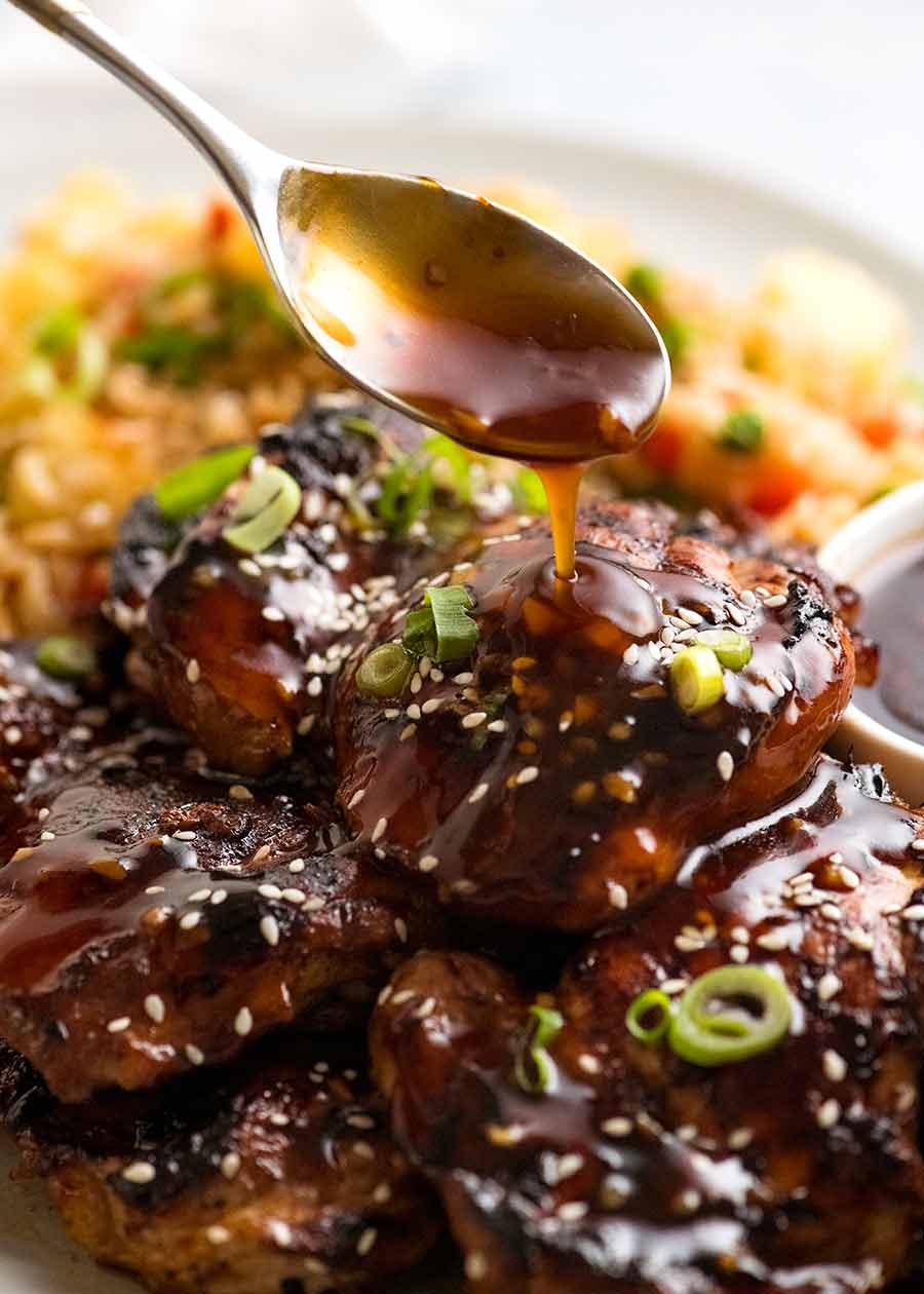 Pour honey soy sauce over chicken