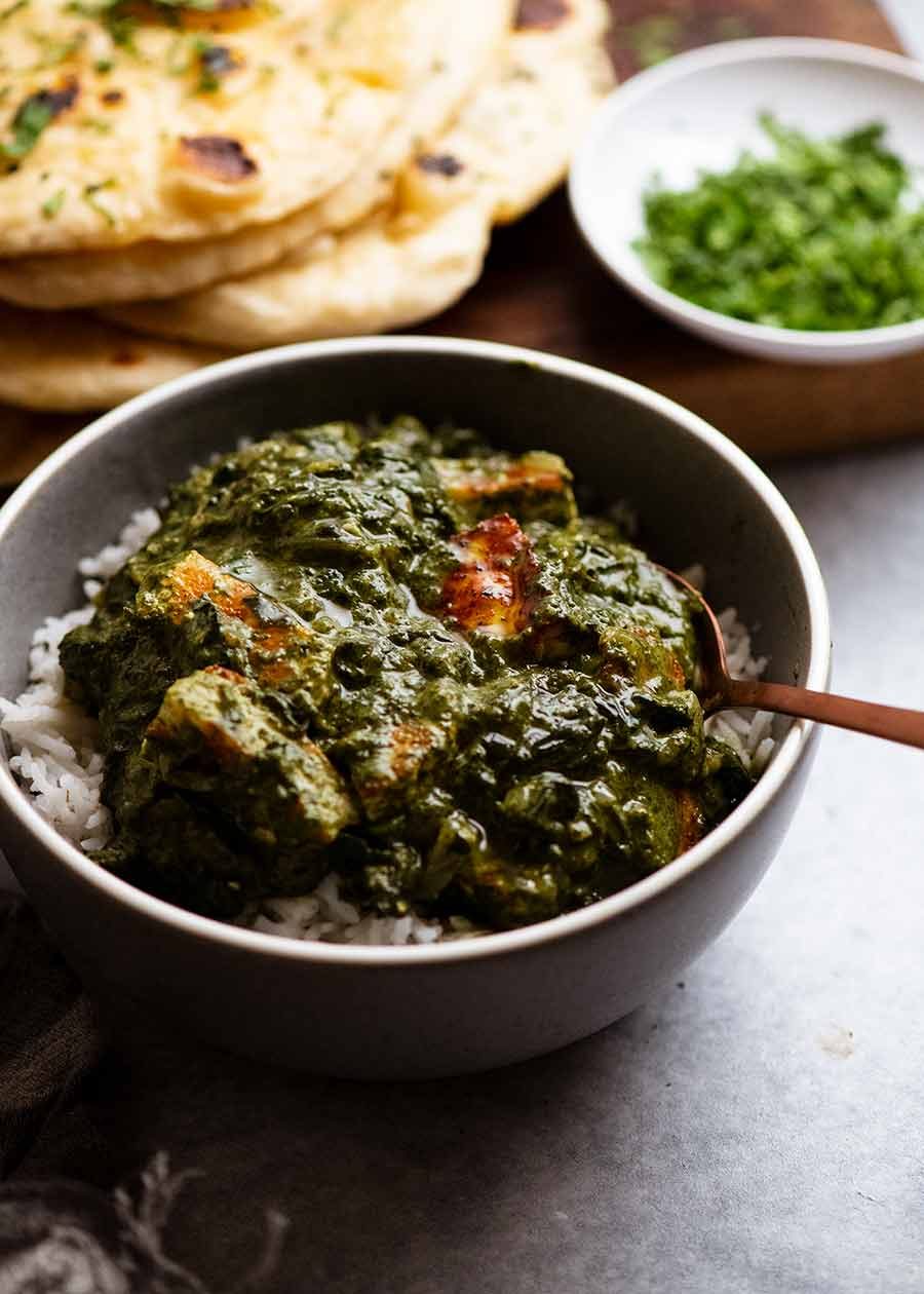 Palak Paneer in a bowl, served over basmati rice