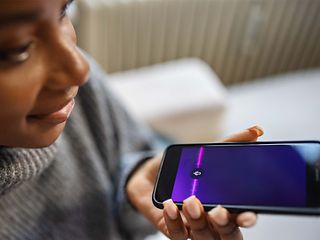  Young woman with a smartphone in her hands