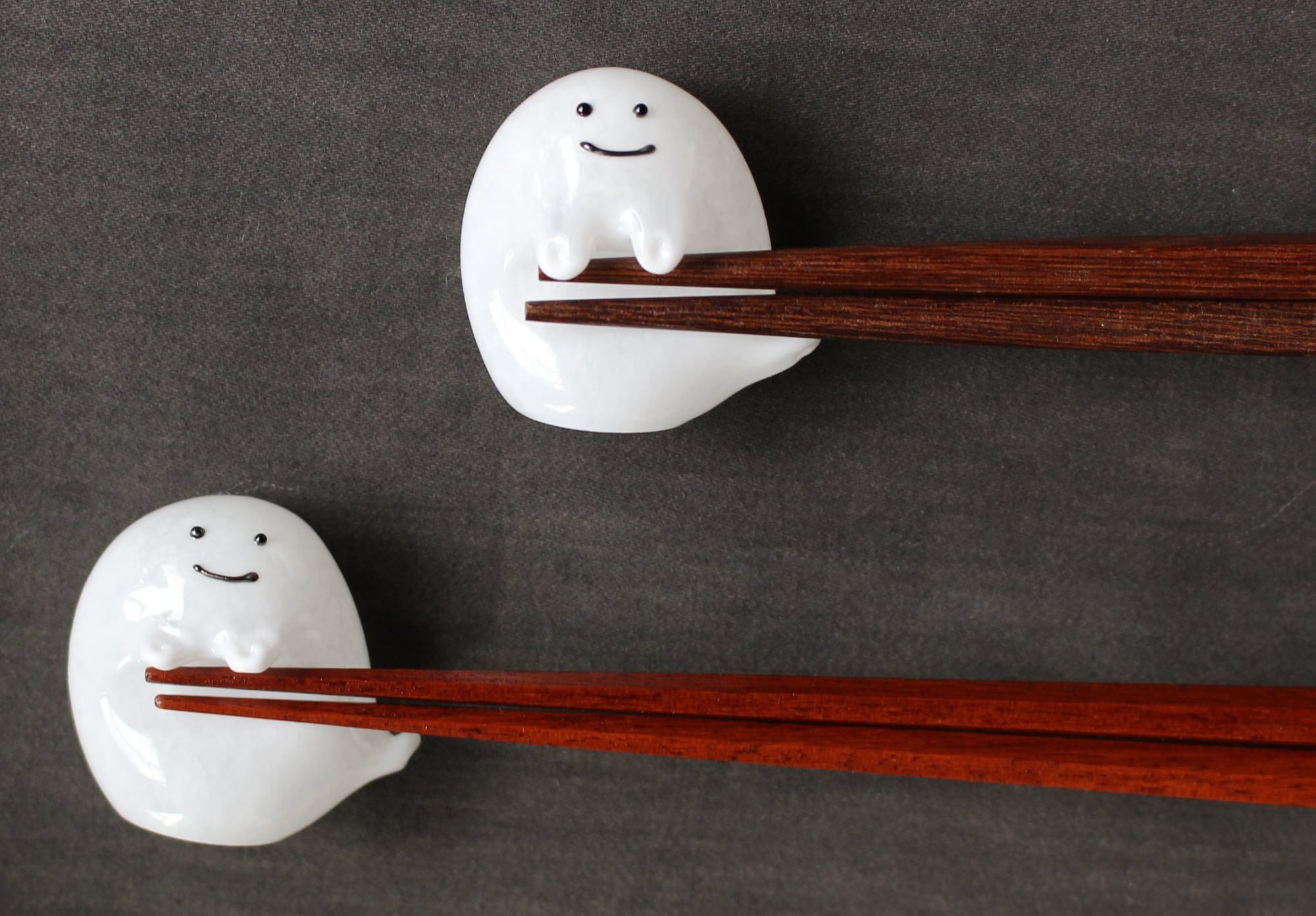 Adorable Glass Ghosts by Masanaga Noike Cradle Chopsticks on Their Bellies