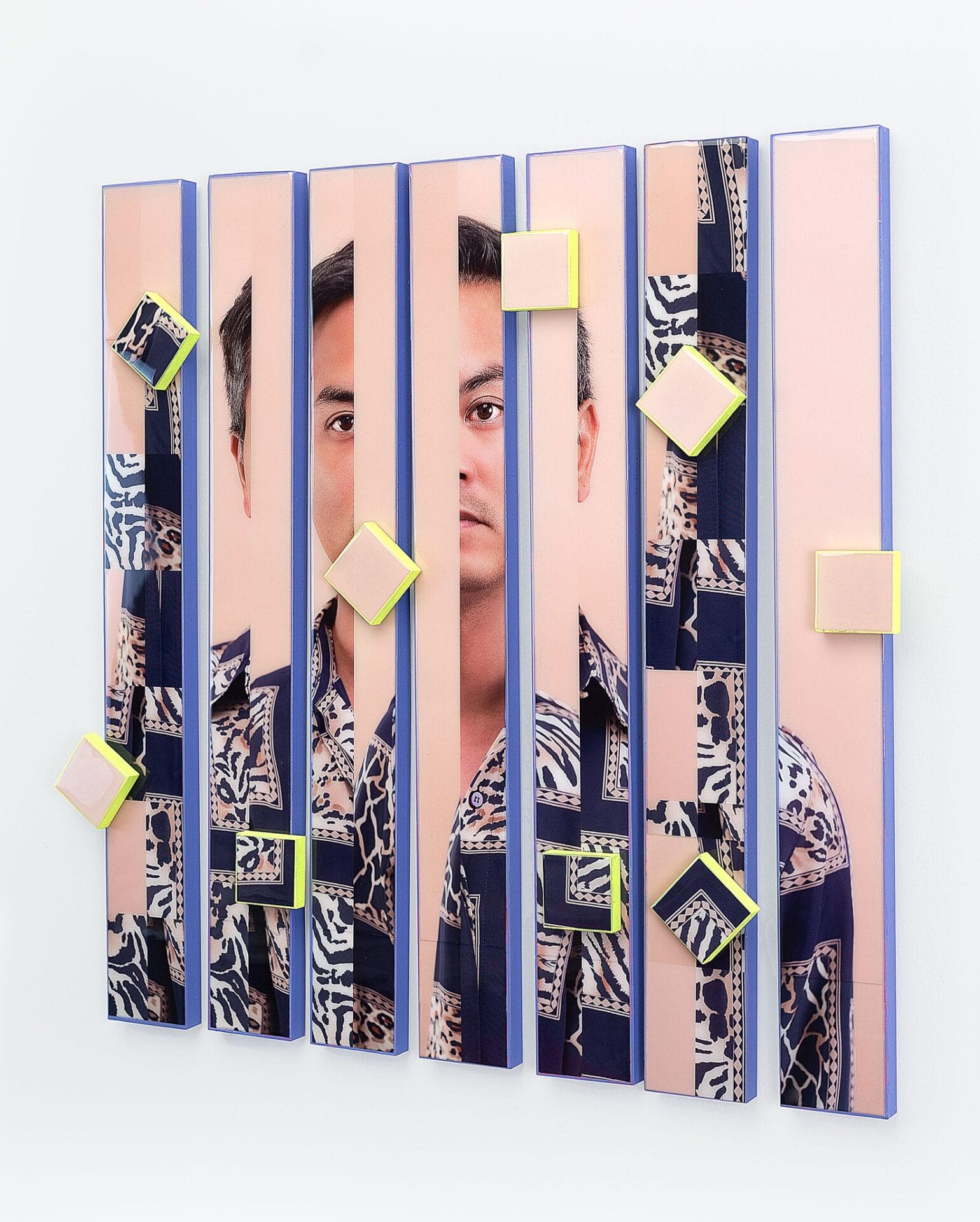 A photograph of a Native American man in a patterned shirt that has been fragmented and reassembled.