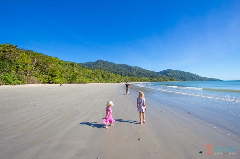 two girls walking on Cape Tribulation beach