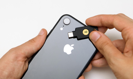 YubiKey 5C NFC next to mobile phone