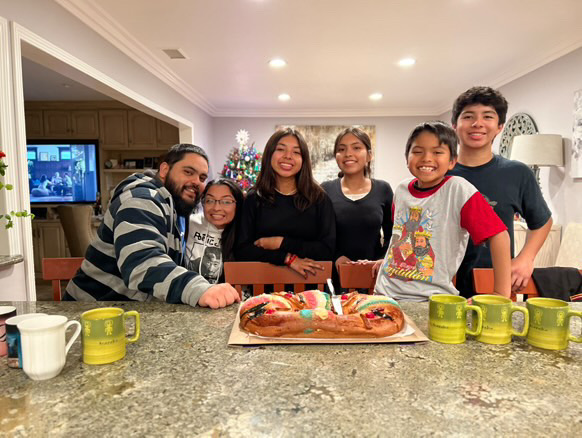 Emmanuel Santiago '25 and his family love sharing La Rosca Pan on Christmas Eve!