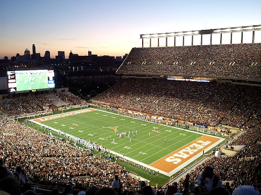 A Texas home game where the fans are cheering loudly.