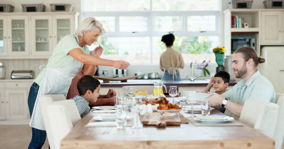 Home food, serving chicken or happy family lunch, eating meal or sharing at Thanksgiving buffet. Grandmother, sitting kids and senior man, woman or people bond, hungry and enjoy turkey meat together