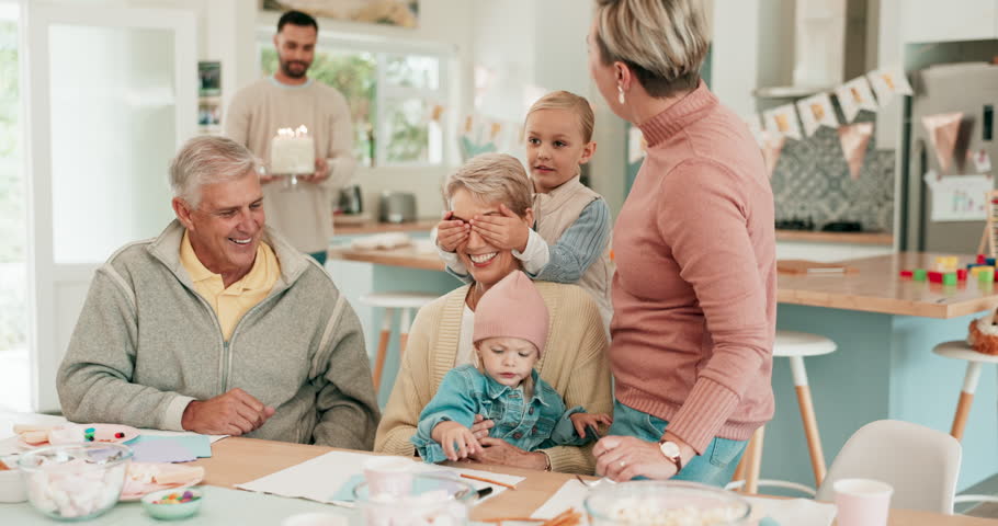 Surprise, birthday and senior woman with family for celebration, fun and bond in their home together. Cake, candle and grandmother with children in a house for party, celebrating and event with love