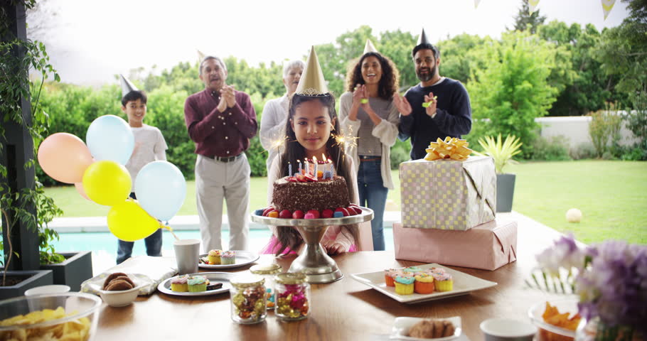 Birthday party, cake and child blow candles, flame and happy family applause to celebrate childhood event. Sparkler, dessert and home kid celebration, congratulations or cheers from clapping people