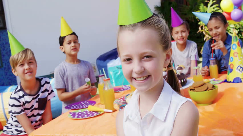 Children celebrating birthday party with confetti animation over outdoor scene. Celebration, fun, happiness, outdoors, kids, festive