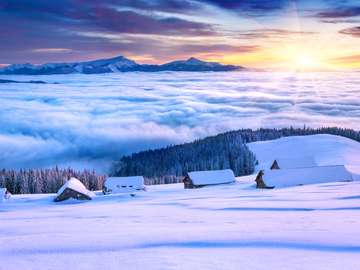 Mountain village covered with snow and clouds jigsaw puzzle online