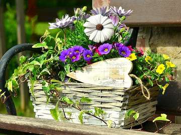 Basket of flowers with a wooden heart jigsaw puzzle online