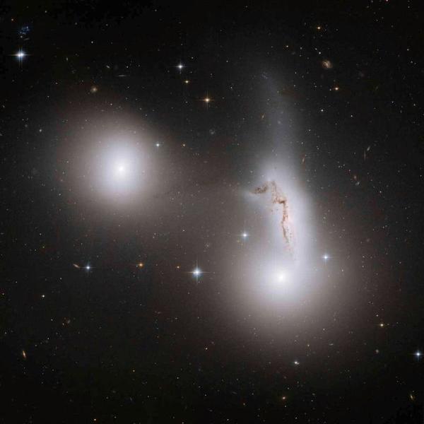 gravitational forces destructive tear galaxies