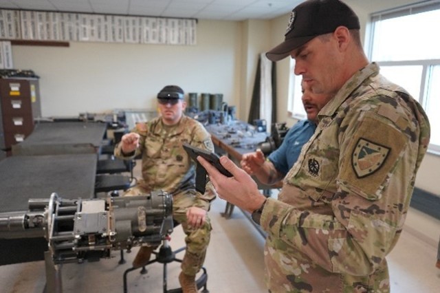 During a recent Soldier touchpoint at the Master Gunner School at Fort Moore, Georgia, instructors familiarize themselves with the heads-up display and iPads.