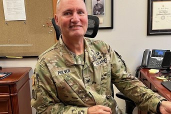 Army bandleader sees the past and future as a grandparent