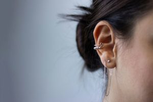 A woman close-up with a conch piercing.