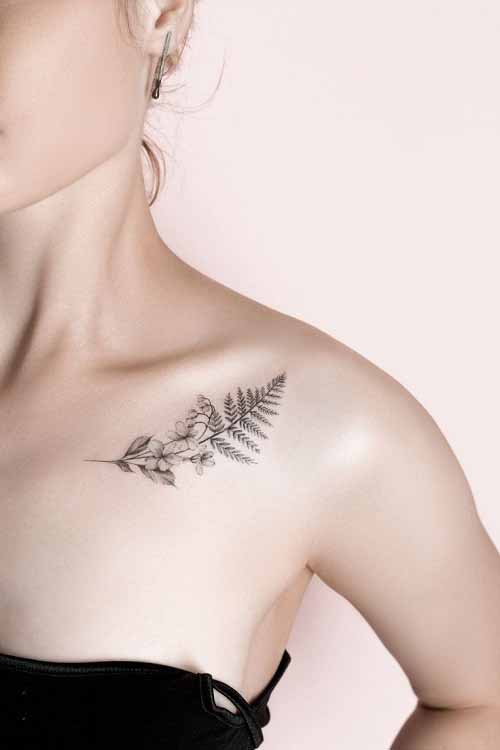 Small Fern Leaf and Flowers on Collar Bone tattoo