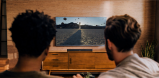 two man watching looking at TV setup with smart TV accessories