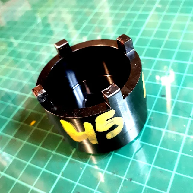The castellated locknuts on the pivot bolt were easily removed using the correct 45 mm tool, but after that it got difficult... The castellated locknuts on the pivot bolt were easily removed using the correct 45 mm tool, but after that it got difficult...