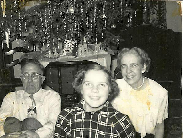 Dad/Betsy/Mom on Christmas --probably about 1954