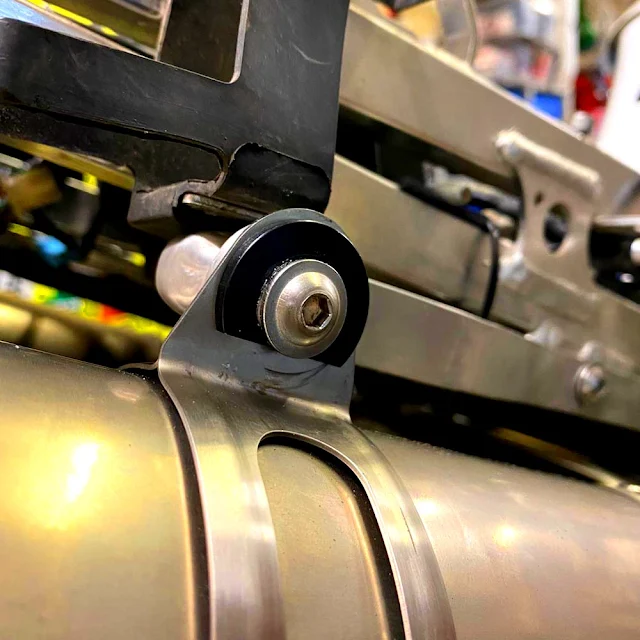 The exhaust hanger washers were machined to allow clearance for the bodywork. ExhaThe exhaust hanger washers were machined to allow clearance for the bodywork.ust Hanger Washers were machined to allow clearance for the bodywork.