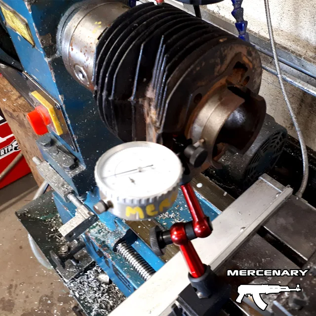 Checking the run-out of the barrel in the lathe using a dial-gauge. Checking the run-out of the barrel in the lathe using a dial-gauge.