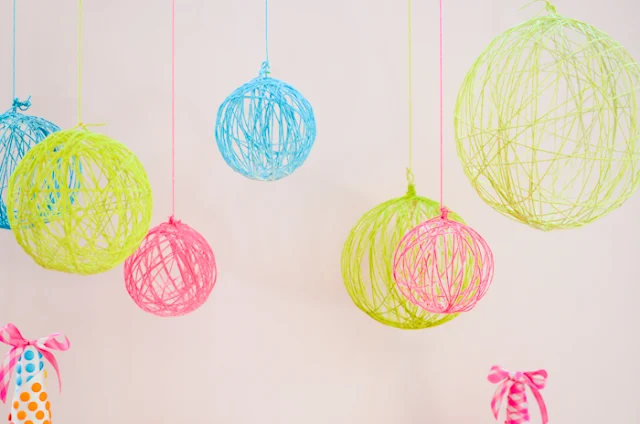 Colourful yarn Chandeliers.