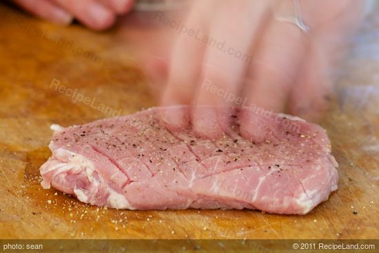 Season the pork with salt and black pepper.