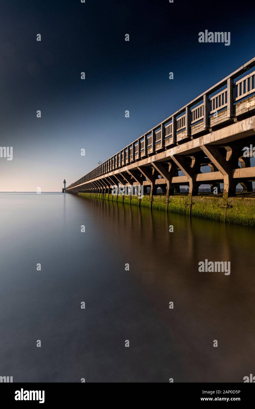 Looking down the Calais pier. Stock Photo