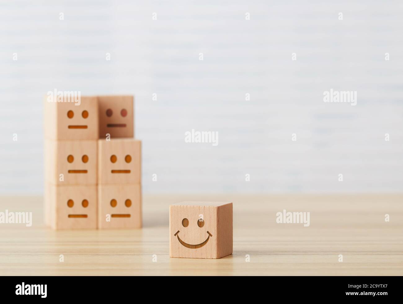 Smiley face on wooden cube Stock Photo