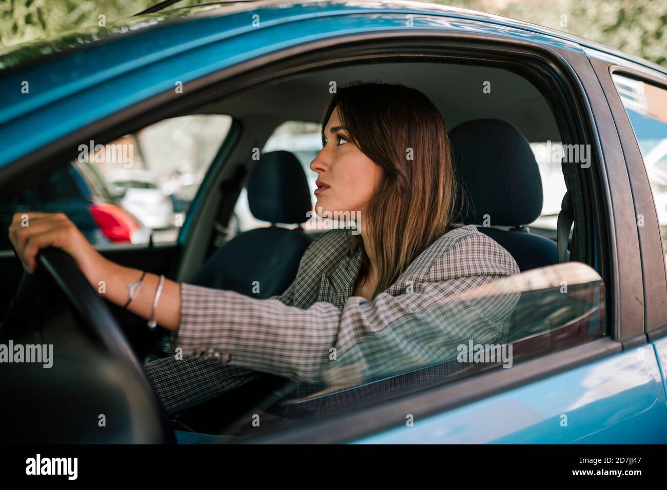 Young woman driving car Stock Photo