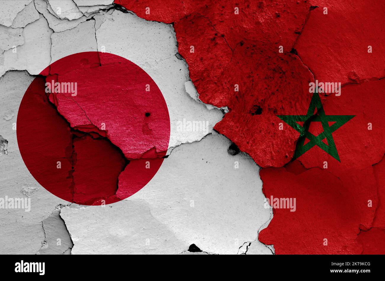 flags of Japan and Morocco painted on cracked wall Stock Photo