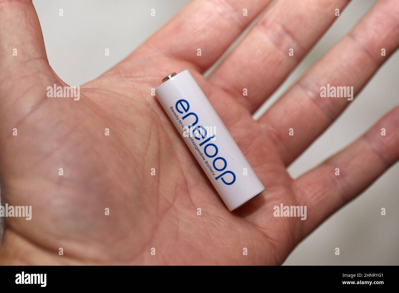 1.5 Volt AA Battery in hand Stock Photo