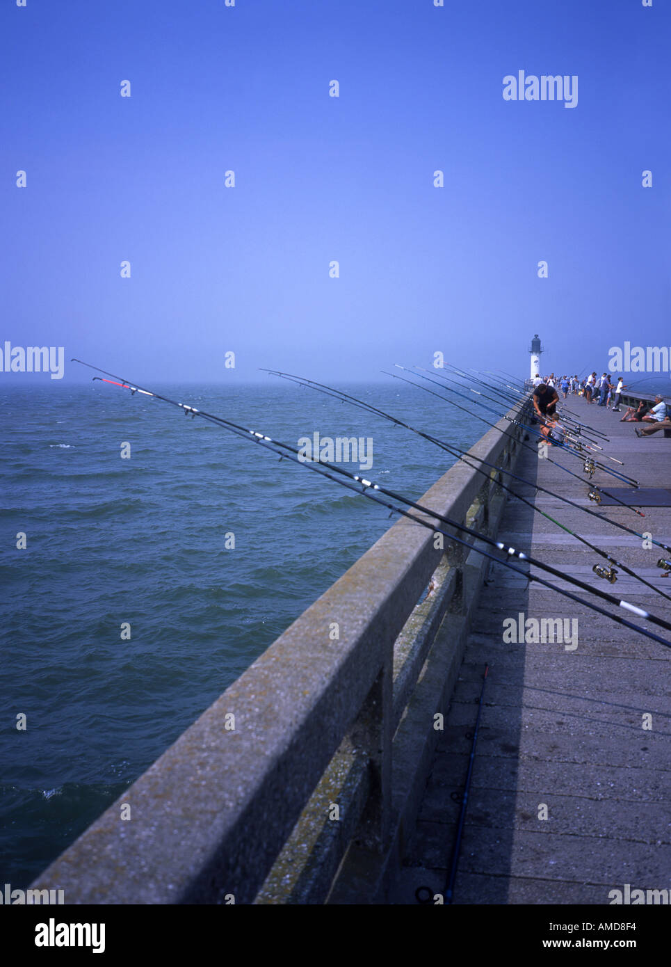 Fishing rods on Calais pier Stock Photo