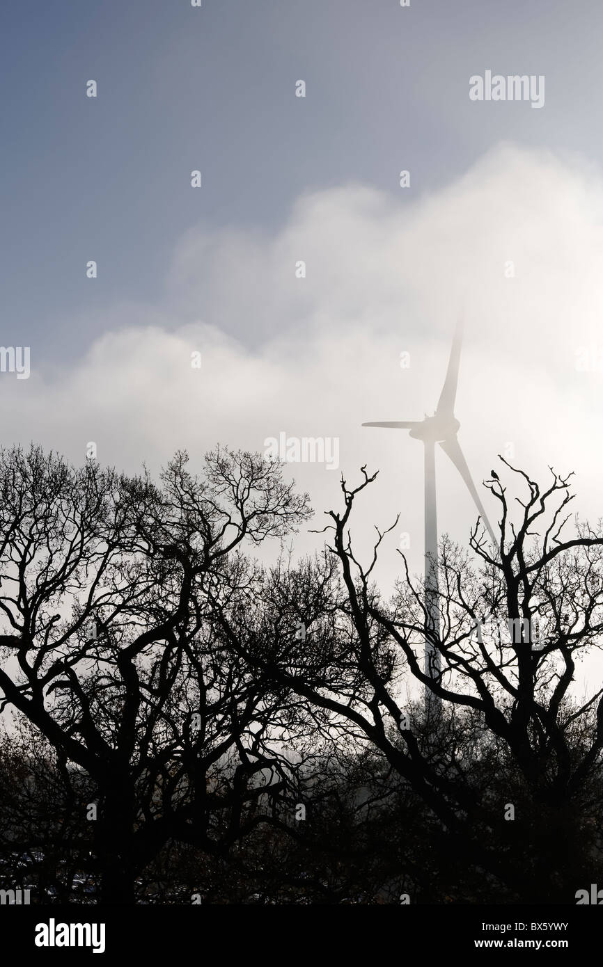 Wind Turbine in the mist Stock Photo