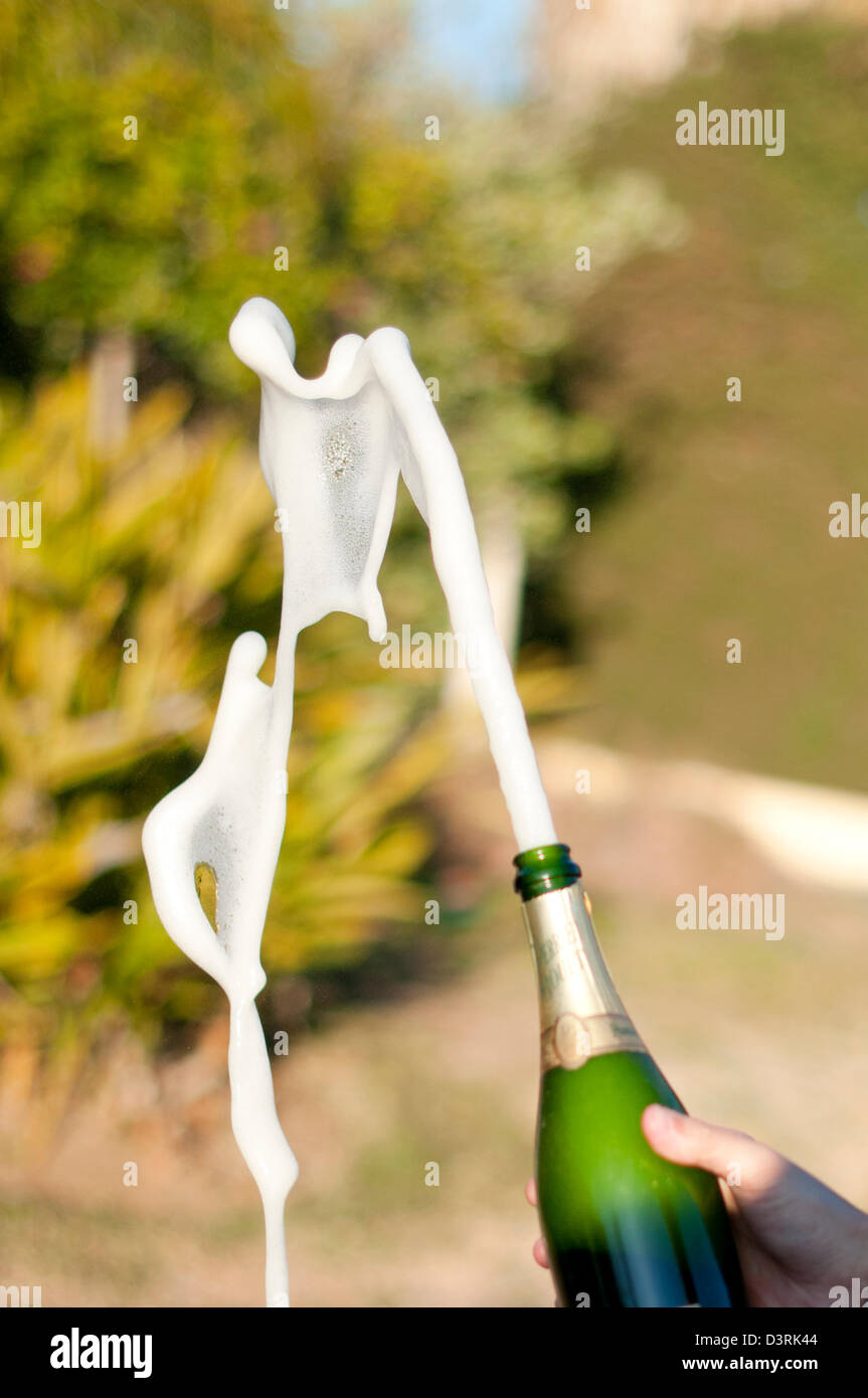 Champagne bottle popping Stock Photo