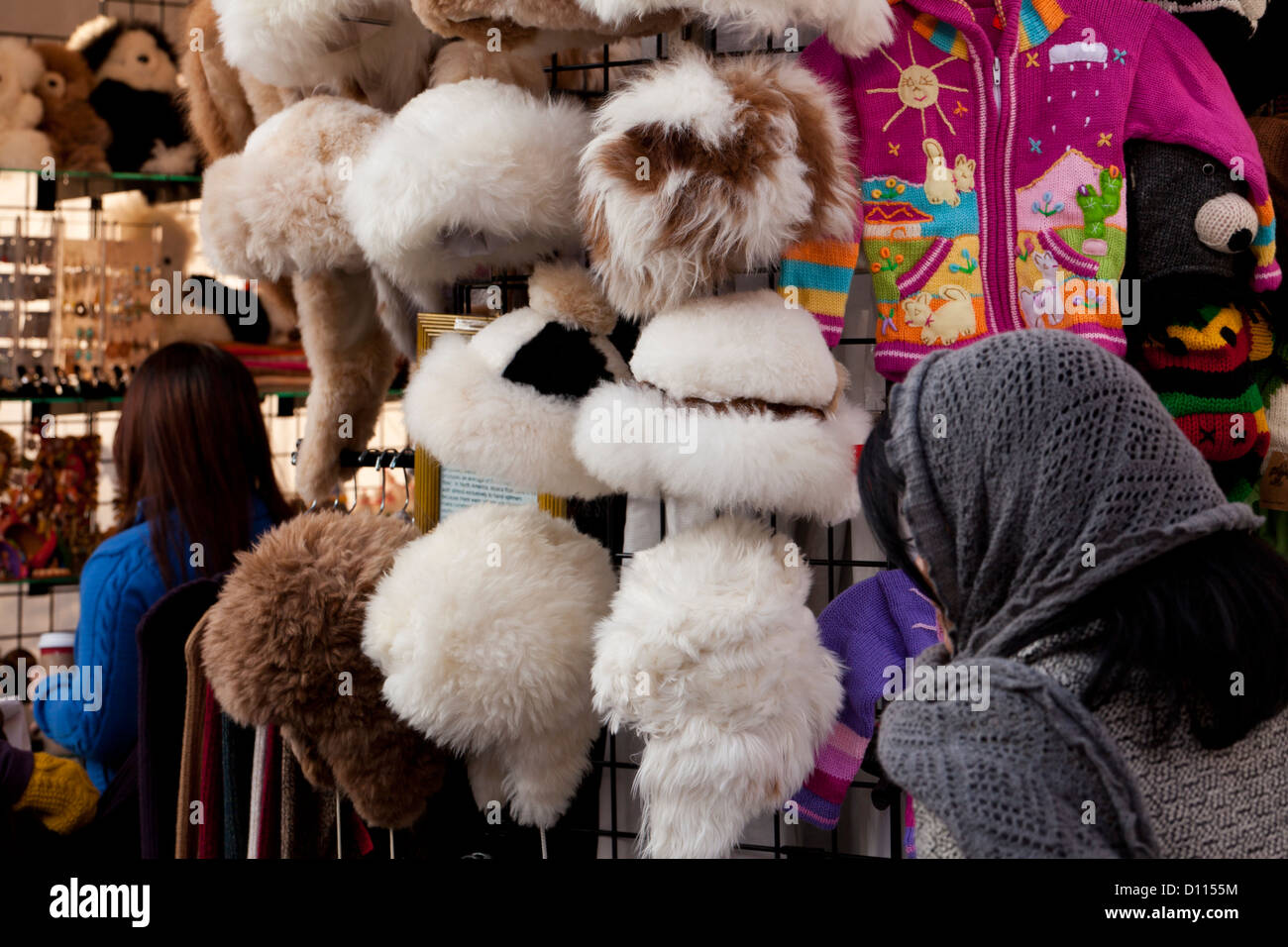 Womens fur hats on rack Stock Photo