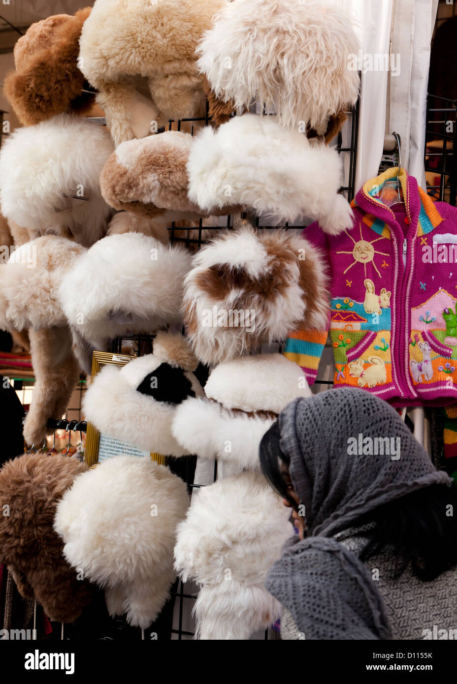 Womens fur hats on rack Stock Photo