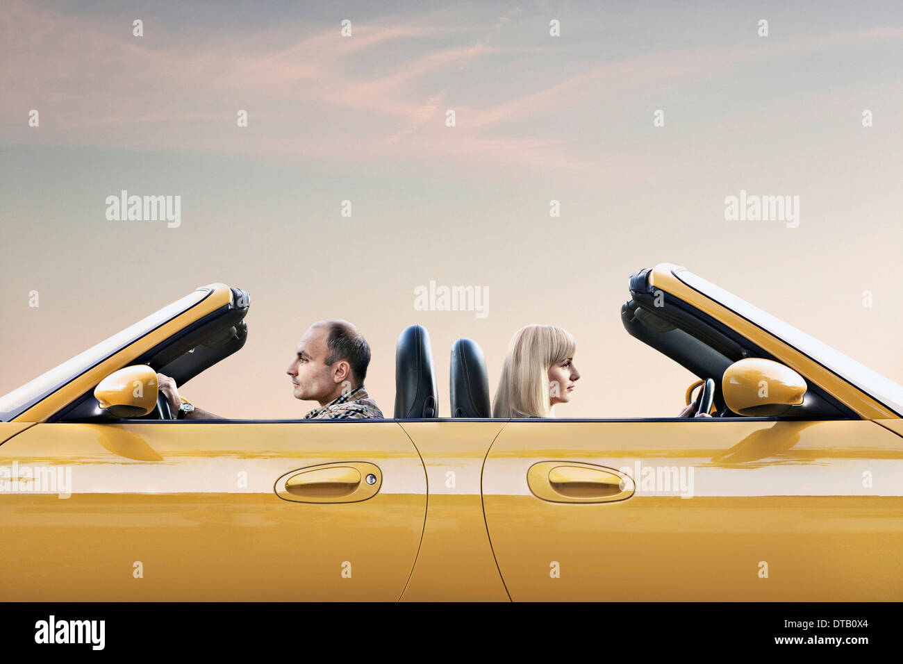 Man and woman driving car Stock Photo