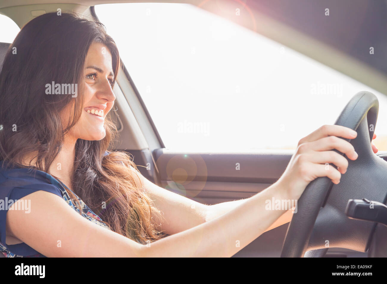 Young woman driving car Stock Photo