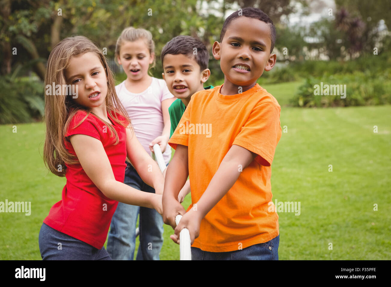 Kids pulling a large rope Stock Photo