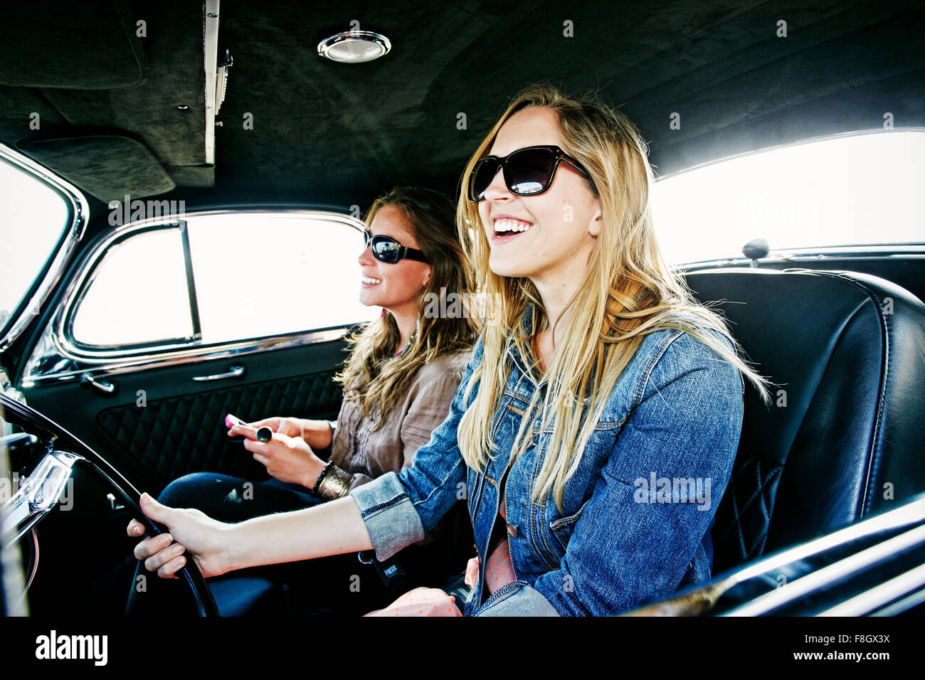 Women driving vintage car Stock Photo