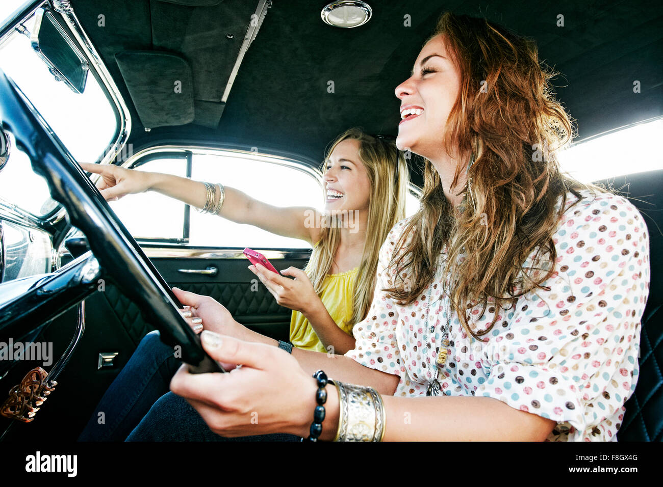 Women driving vintage car Stock Photo