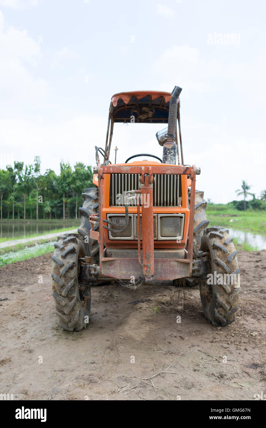 Tractor in a rice field Stock Photo