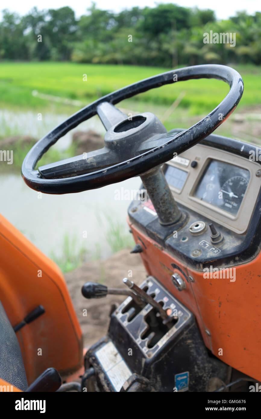 Tractor in a rice field Stock Photo