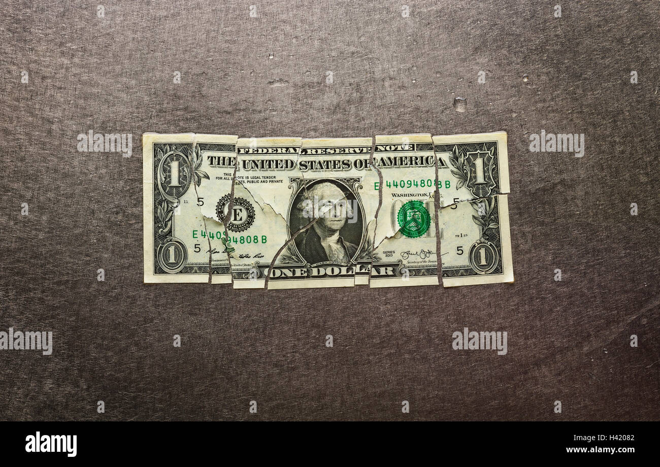 Broken dollar bill Stock Photo